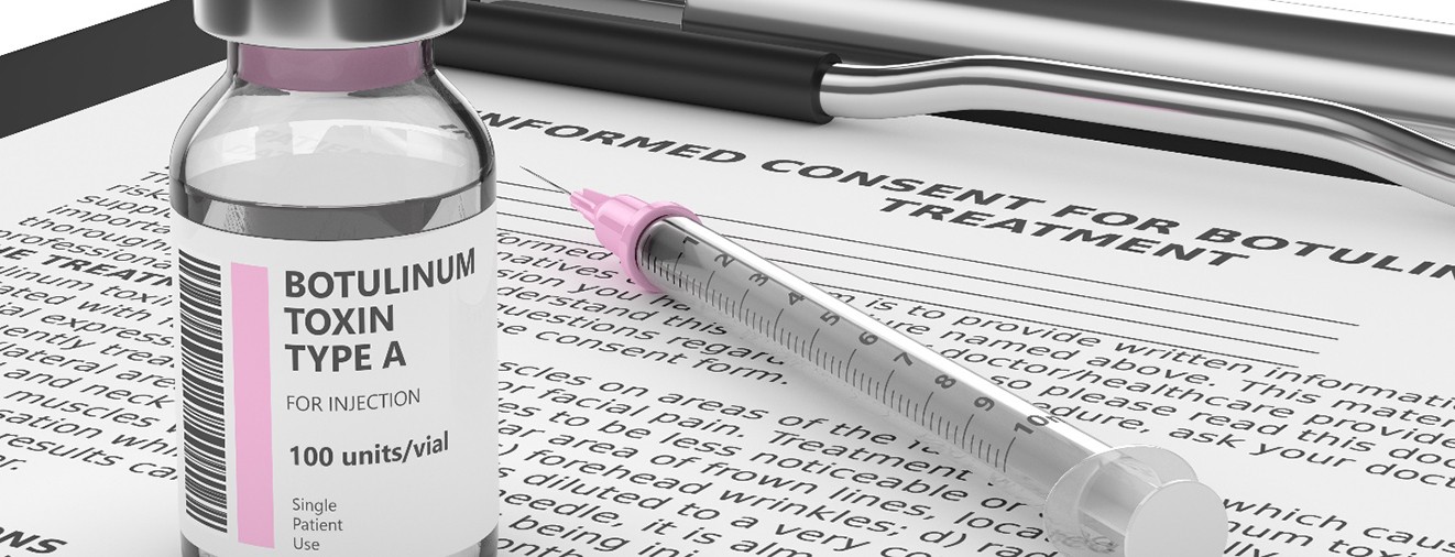 Vial of botulinum toxin type A on top of document