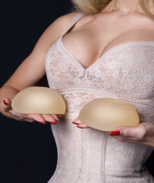 Closeup of woman's breast line after breast implants