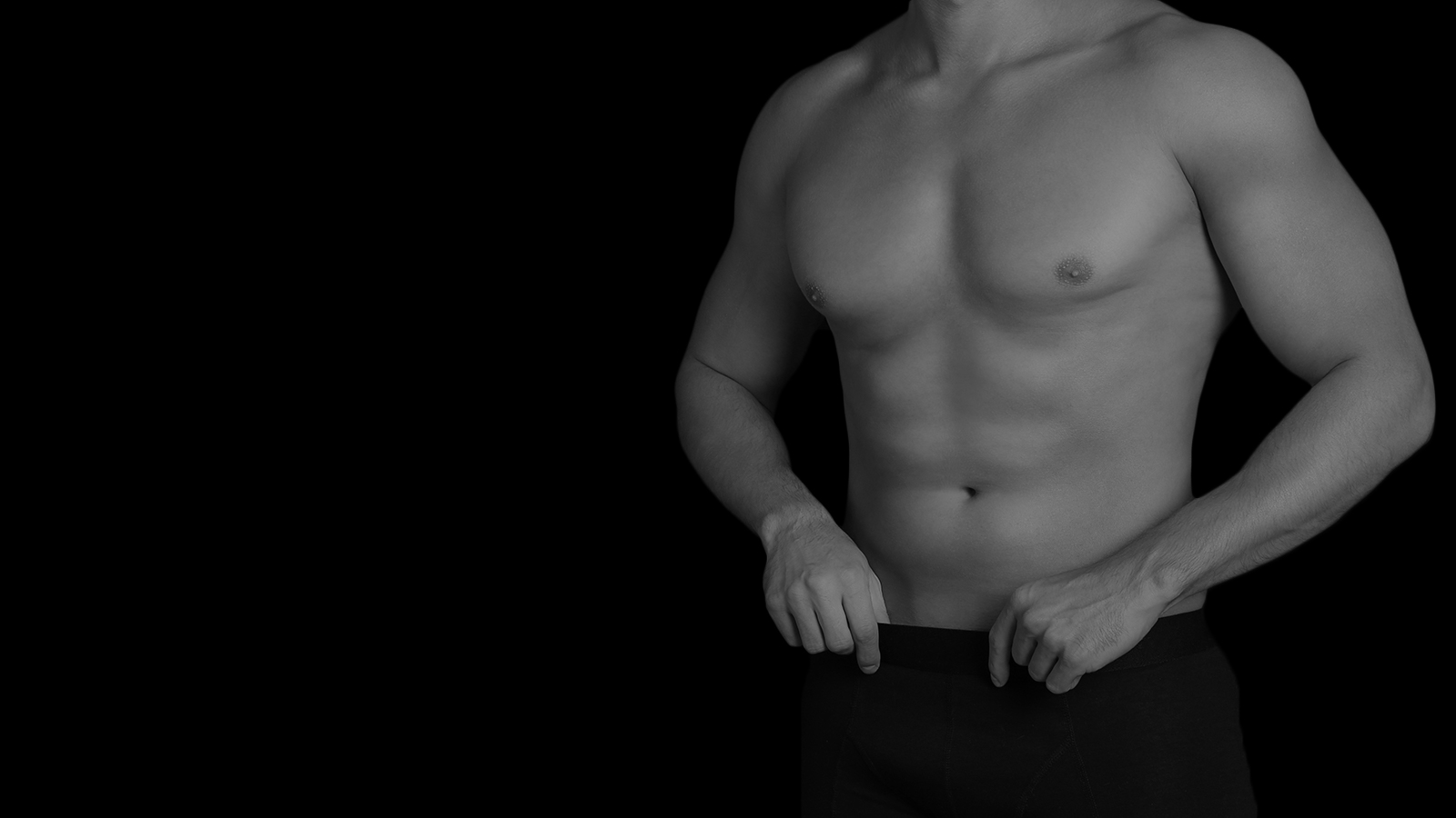 Man's toned abs after liposuction