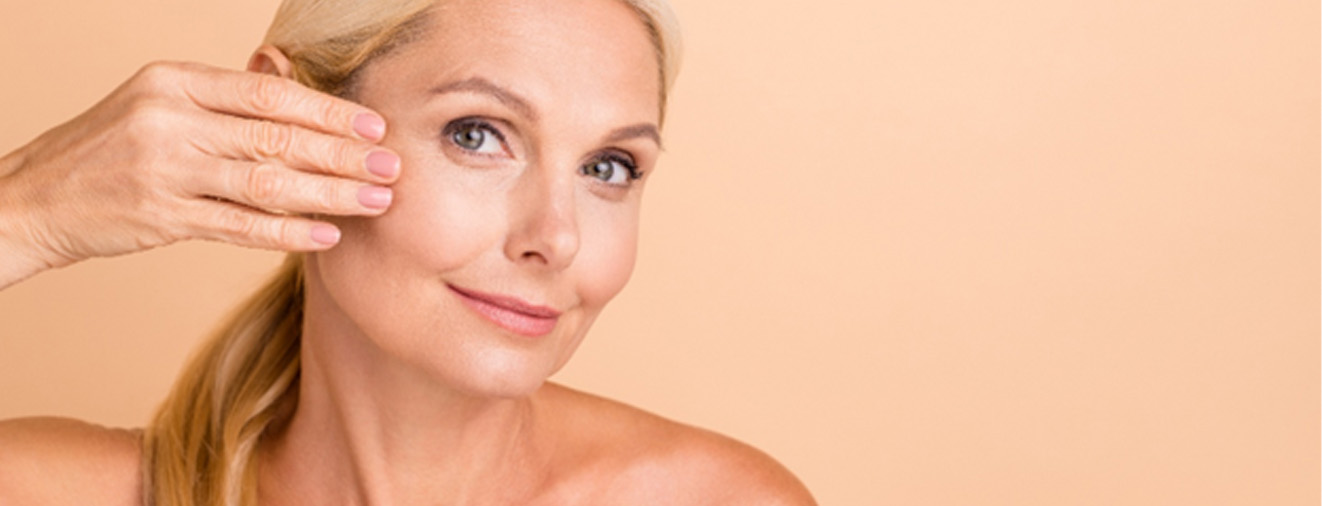 Mature woman showing the results of her facelift surgery