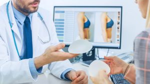 Doctor and patient talking about breast implants