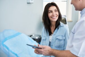 Patient and doctor talking during plastic surgery consultation