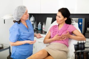 Patient talking to medical team member about breast augmentation