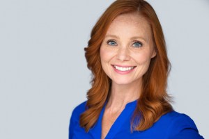 woman in blue shirt smiling